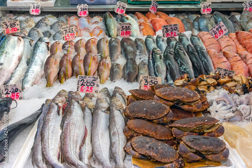 Crayfish, octopus and other fish for sale at a market in London photo