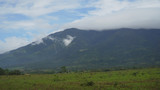 Mountain valley near mount Isarog. Mount with green tropical rainforest, trees, jungle with sky. Philippines, Luzon. Tropical landscape
