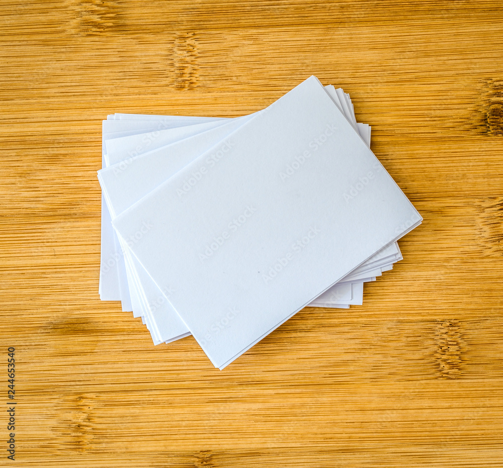 stacking of a mockup empty white business card on a wooden background ,  template for business branding design Stock Photo | Adobe Stock