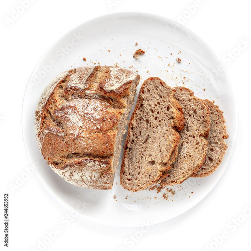Sliced bread on a plate  isolated on  white background. Fresh Bread cutted in a  slices close up. Bakery, food concept. Top view