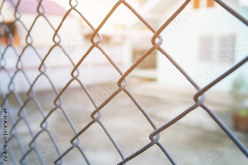 blurred background wire mesh with sunlight