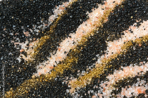 Layered colorful sand pattern. Marble style background. Black, white and gold powder texture