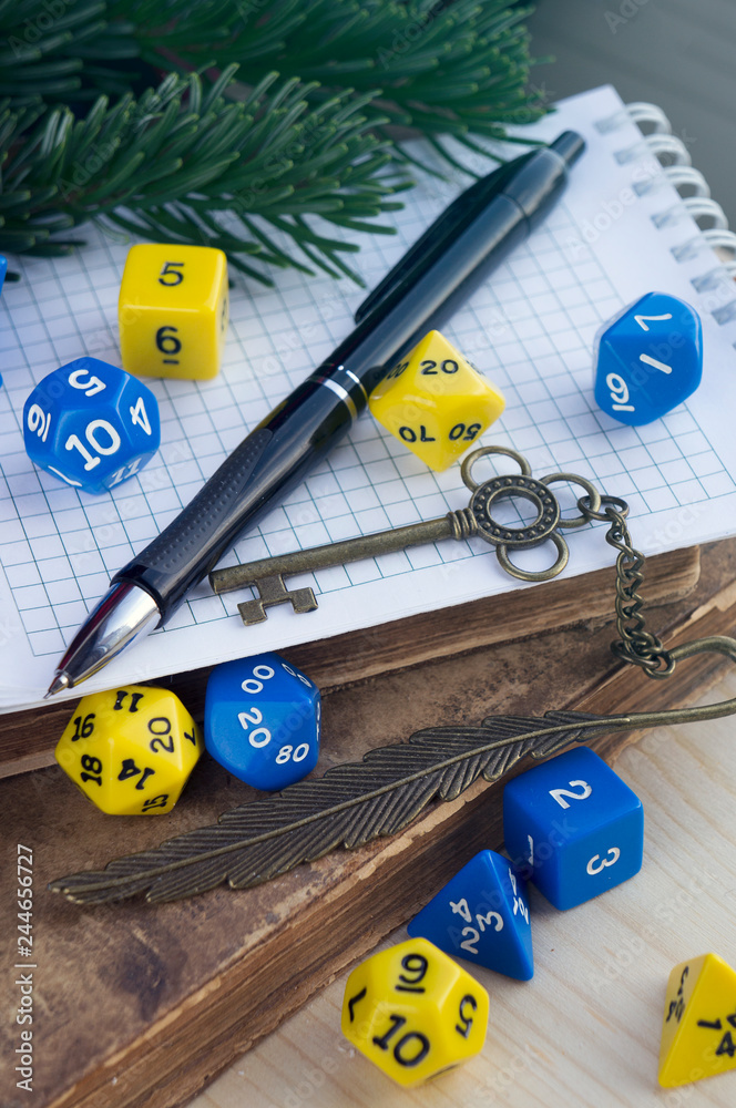 Dices for rpg, dnd, tabletop, or board games, pen, notebook, old decorated  key, old books Stock Photo | Adobe Stock