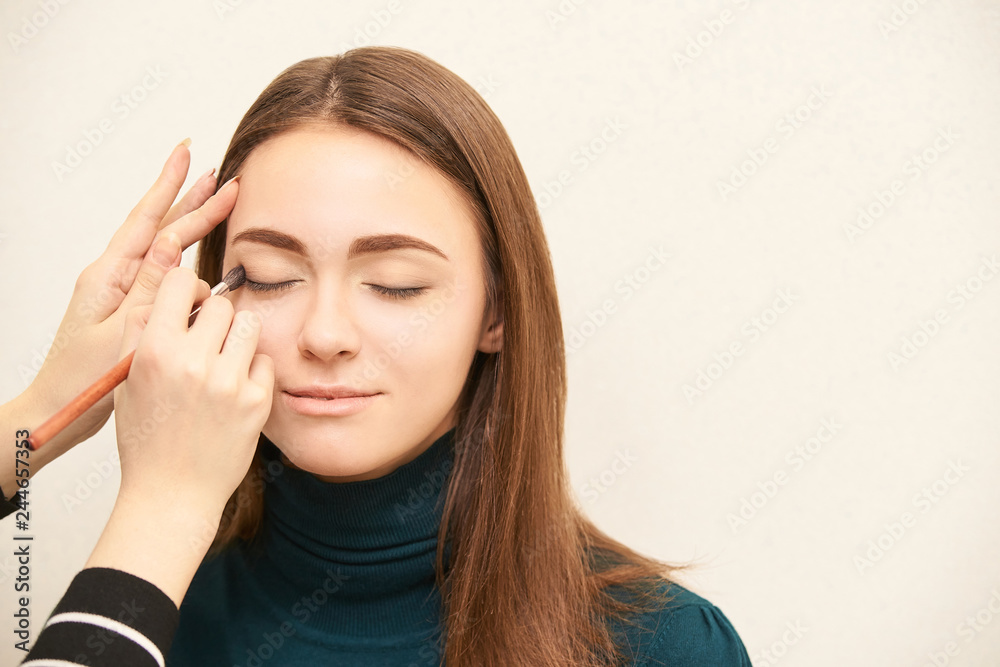 Makeup professional artist apply face mascara. Woman beauty model. Nature nude look. Contour foundation Makeup professional artist apply face mascara. Woman beauty model. Nature nude look. Contour foundation