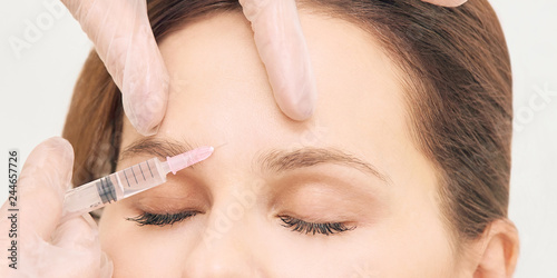 Prp plasma treatment. Facial rich cosmetology injecting. Woman  doctor hands. Patient clinic