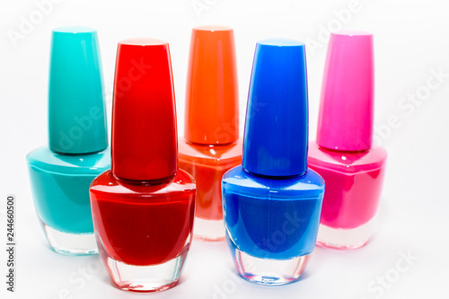 colorful bottles of nail polish isolated on white