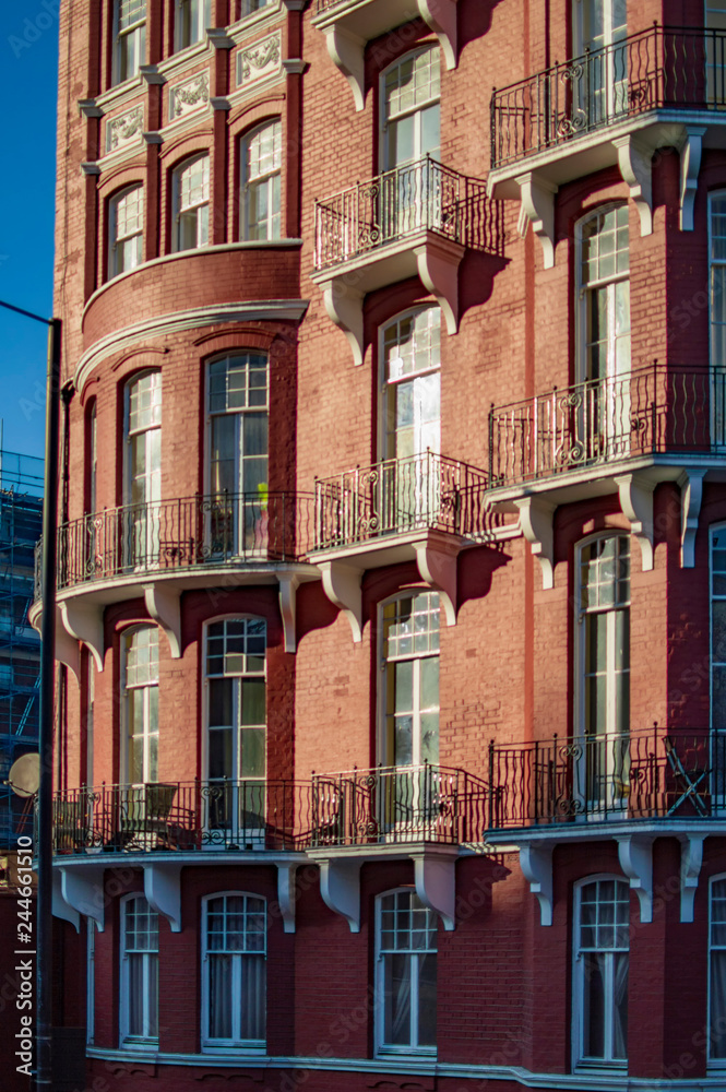 Fototapeta premium Red brick building in london with many balconies