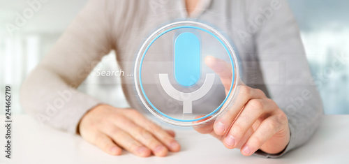 Businessman holding a Vocal search system with button and icon3d rendering photo