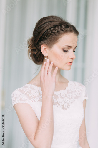 The bride in the white Studio with a bouquet. Wedding in the European style fine art.