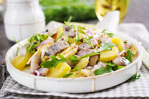 Traditional  salad of salted herring fillet, fresh apples,  red onion  and potatoes. Kosher food. Scandinavian cuisine.