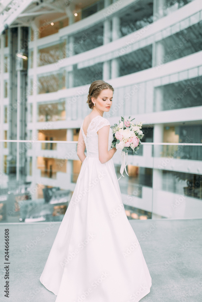 The bride is in a bright shopping center. Wedding in the European style fine art. The bride is in a bright shopping center. Wedding in the European style fine art.