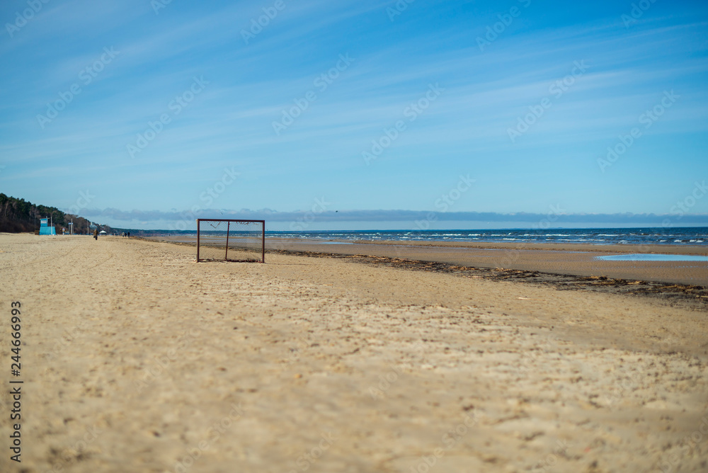 old, torn football gates on the beach nobody's sunny old, torn football gates on the beach nobody's sunny