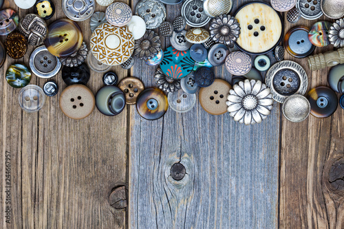 intage buttons on aged boards surface photo