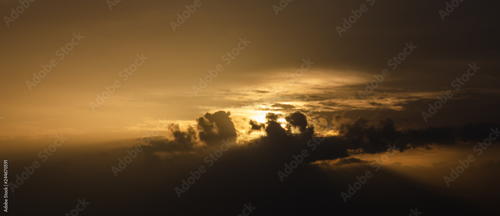 Sun ray with clouds in sunset sky