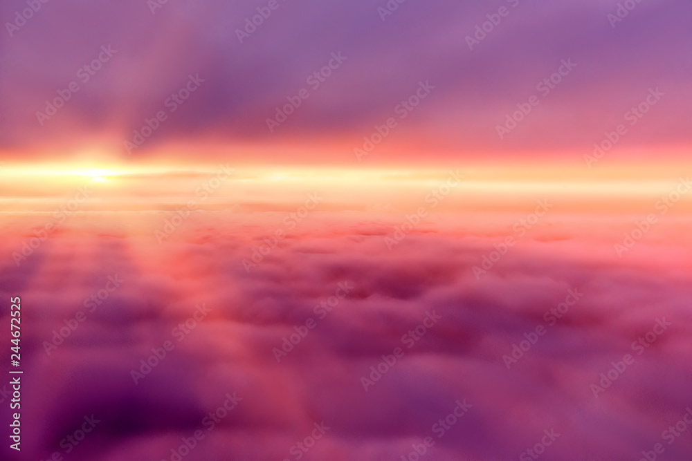 red sky and sun between clouds on sunrise morning day aerial panorama airplane window seat view copy space abstract design background