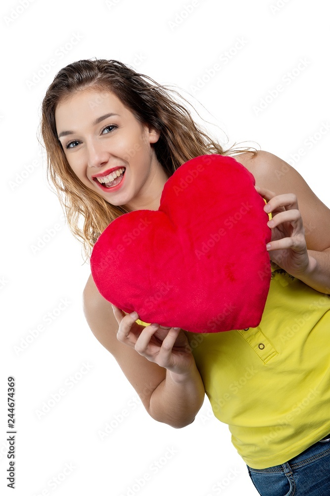 pretty young woman dressed in yellow with a red heart on white pretty young woman dressed in yellow with a red heart on white