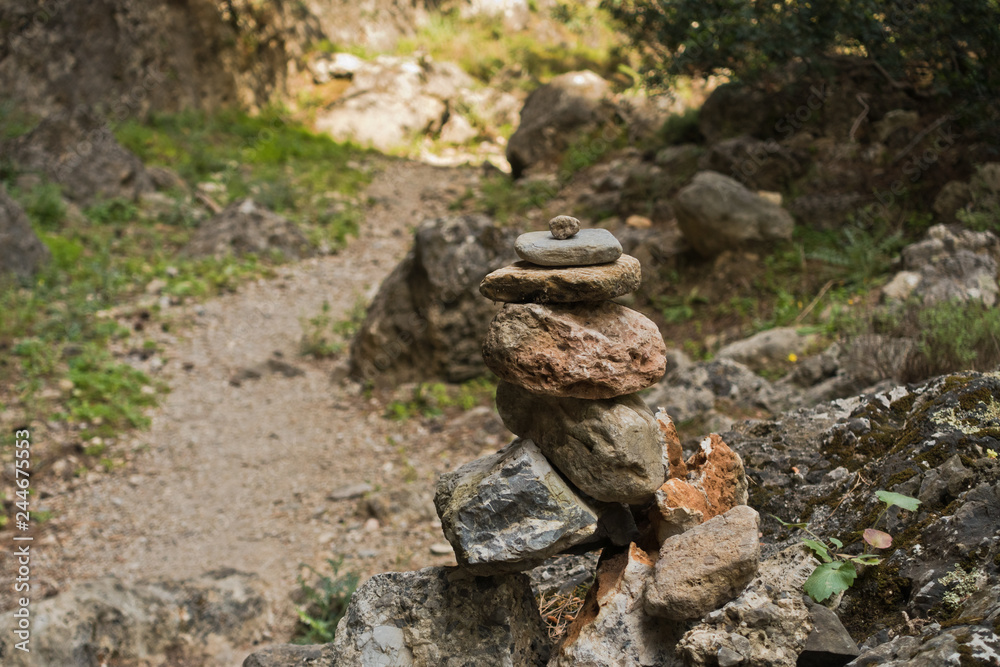 Trail marker on a winding path through Lissos gorge near Sougia, south-west coast of Crete island, Greece Trail marker on a winding path through Lissos gorge near Sougia, south-west coast of Crete island, Greece