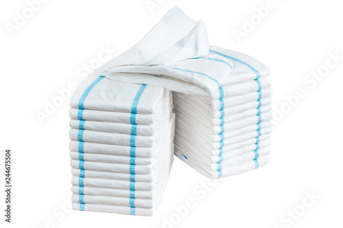 Stacks of adult diapers isolated on white background. Health care for elderly and bedridden people with urinary incontinence