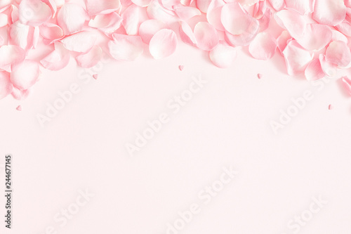 Fototapeta Naklejka Na Ścianę i Meble -  Flowers composition. Rose flower petals on pastel pink background. Valentine's Day, Mother's Day concept. Flat lay, top view, copy space