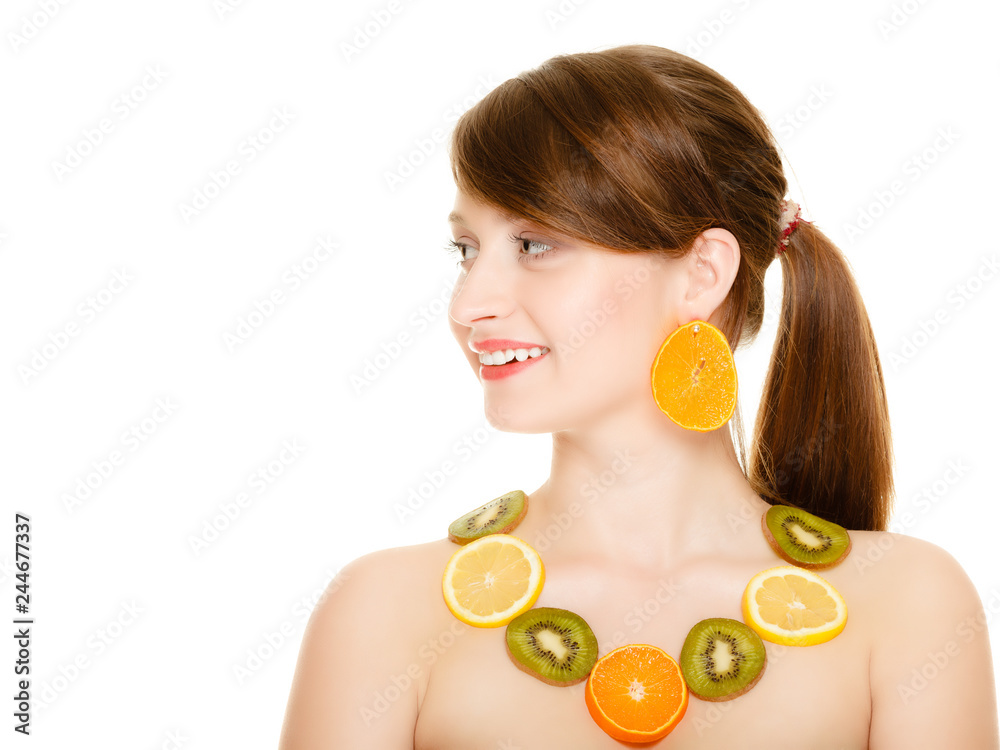 Diet. Girl with necklace of fresh citrus fruits isolated