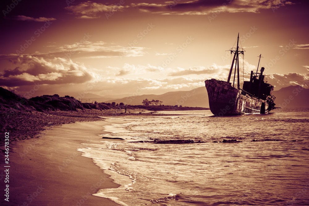 Rusty broken shipwreck on sea shore Rusty broken shipwreck on sea shore