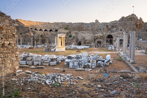 Ruins of the ancient theatre in Side at sunset, Turkey photo