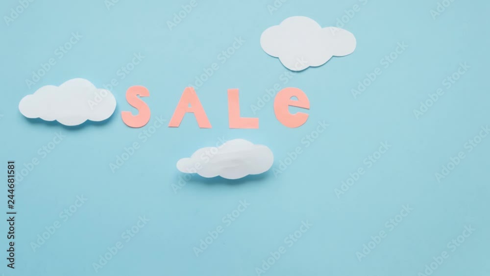 Concept of modern sale. Sky, clouds, parachutes, discounts cut from paper. Stop motion animation loop. Concept of modern sale. Sky, clouds, parachutes, discounts cut from paper. Stop motion animation loop.