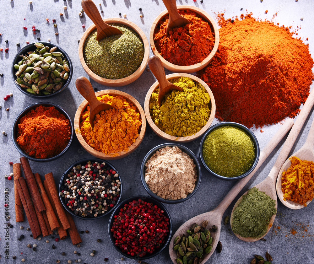 Variety of spices on kitchen table Variety of spices on kitchen table