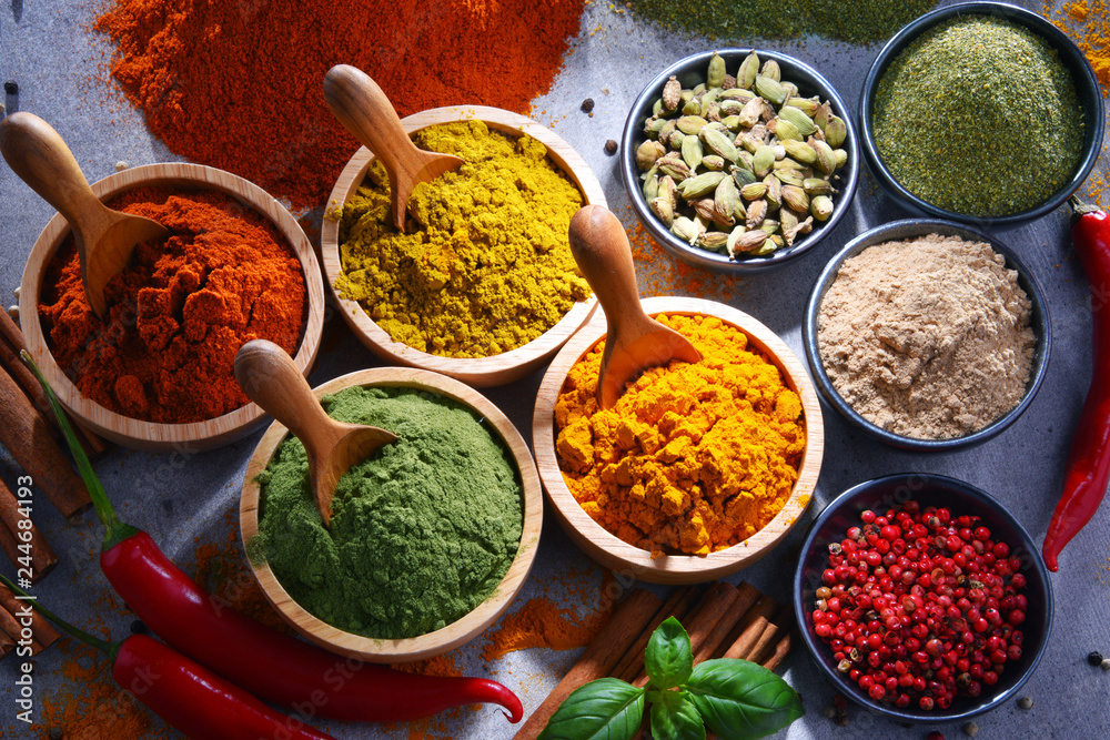 Variety of spices on kitchen table Variety of spices on kitchen table