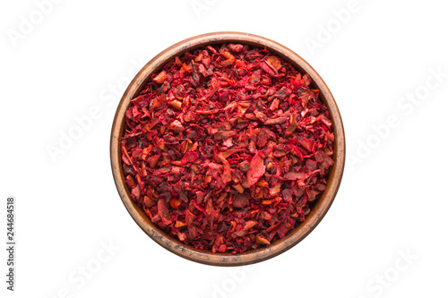 Fototapeta Naklejka Na Ścianę i Meble -  sweet pepper powder spice in wooden bowl, isolated on white background. Seasoning top view