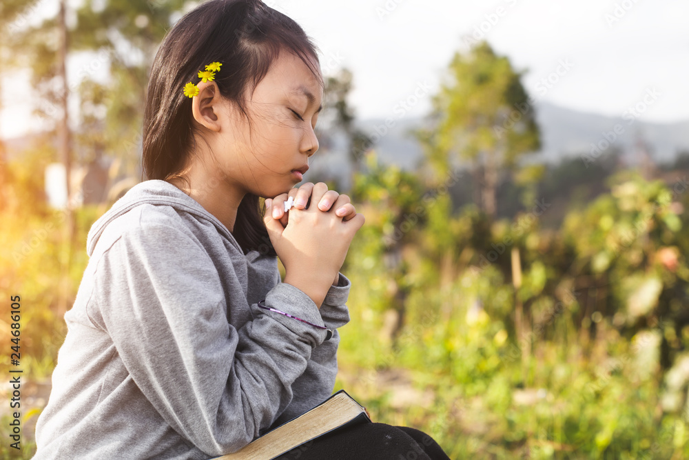 Little girl praying with bible. Peace, hope, christian concept. Little girl praying with bible. Peace, hope, christian concept.