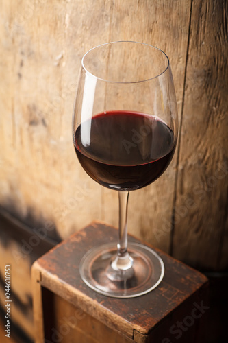 Red wine near a barrel
