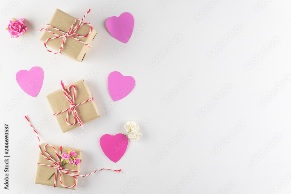 Hand-made pink love hearts and Gift box isolated on white wooden texture background, Happy valentine's day. holiday background, Flat lay, top view, copy space