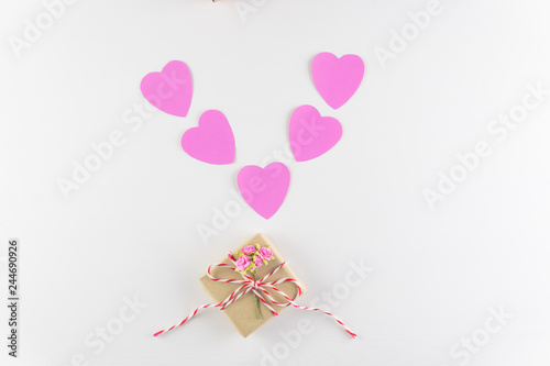 Hand-made pink love hearts and Gift box isolated on white wooden texture background, Happy valentine's day. holiday background, Flat lay, top view, copy space © Ingon