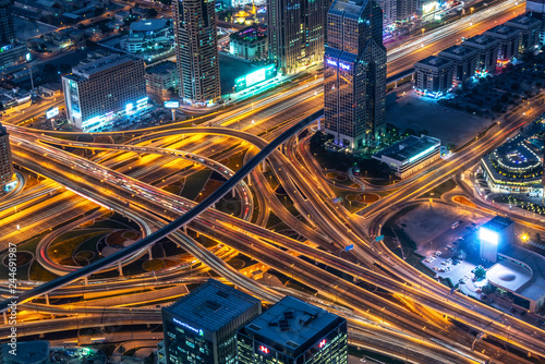 Aerial view of a highway road interchange in Dubai at night, United Arab Emirates