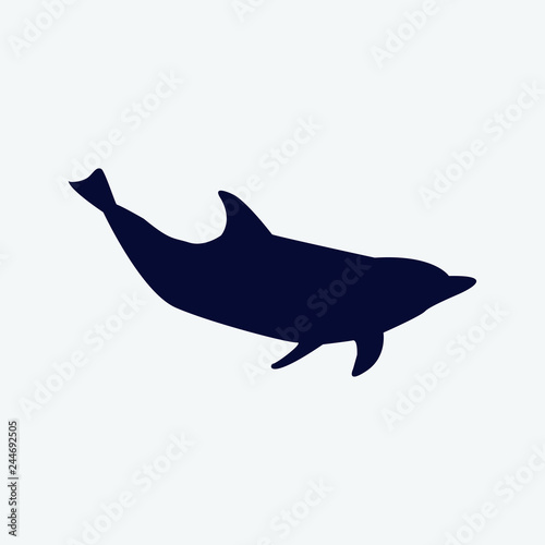 Vector silhouette of a dolphin on a white background.