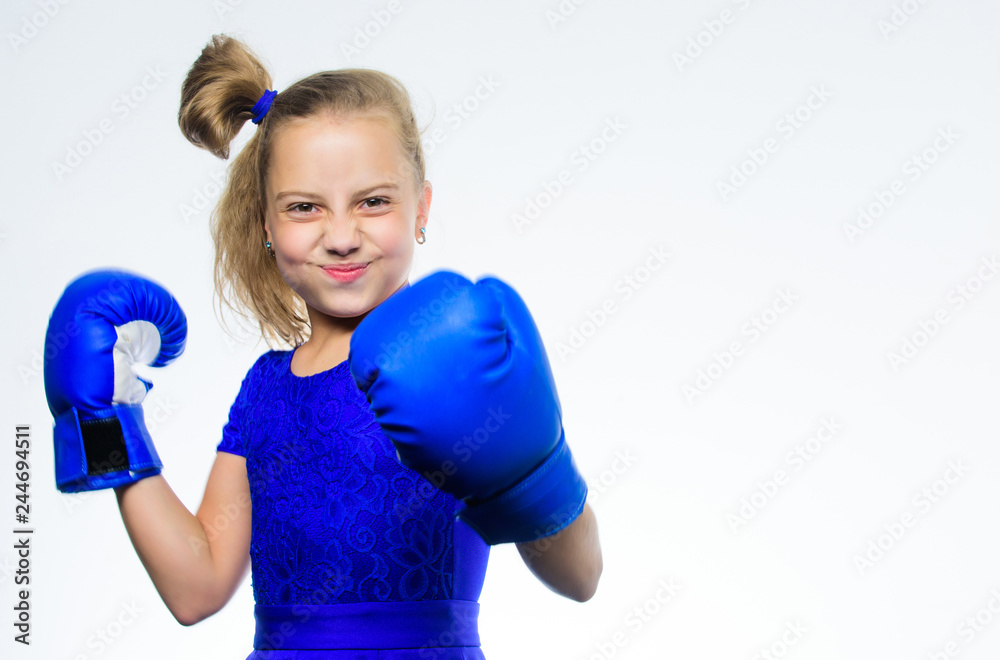 Upbringing for leadership and winner. Sport and health concept. Boxing sport for female. Girl child with blue gloves posing on white background. Sport upbringing. Be strong. Strong child boxing Upbringing for leadership and winner. Sport and health concept. Boxing sport for female. Girl child with blue gloves posing on white background. Sport upbringing. Be strong. Strong child boxing