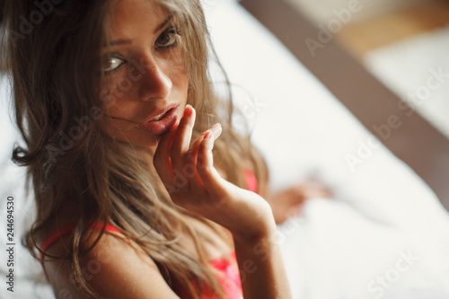 Hot and sexy brunette girl posing for photo in the home studio