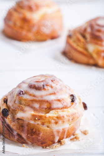 Cinnamon rolls buns on a white marble wooden background. Bakery concept. Breakfast and brunch. Flatlay. Minimalistic photo. Overhead. Copy space