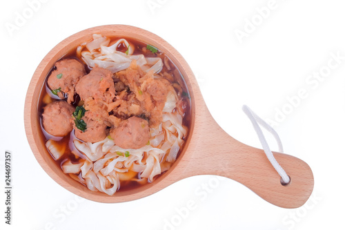 Delicious homemade Bakso, famous traditional Indonesian street food, meatballs with noodles served with chili saucel and soy sauce isolated on white background photo