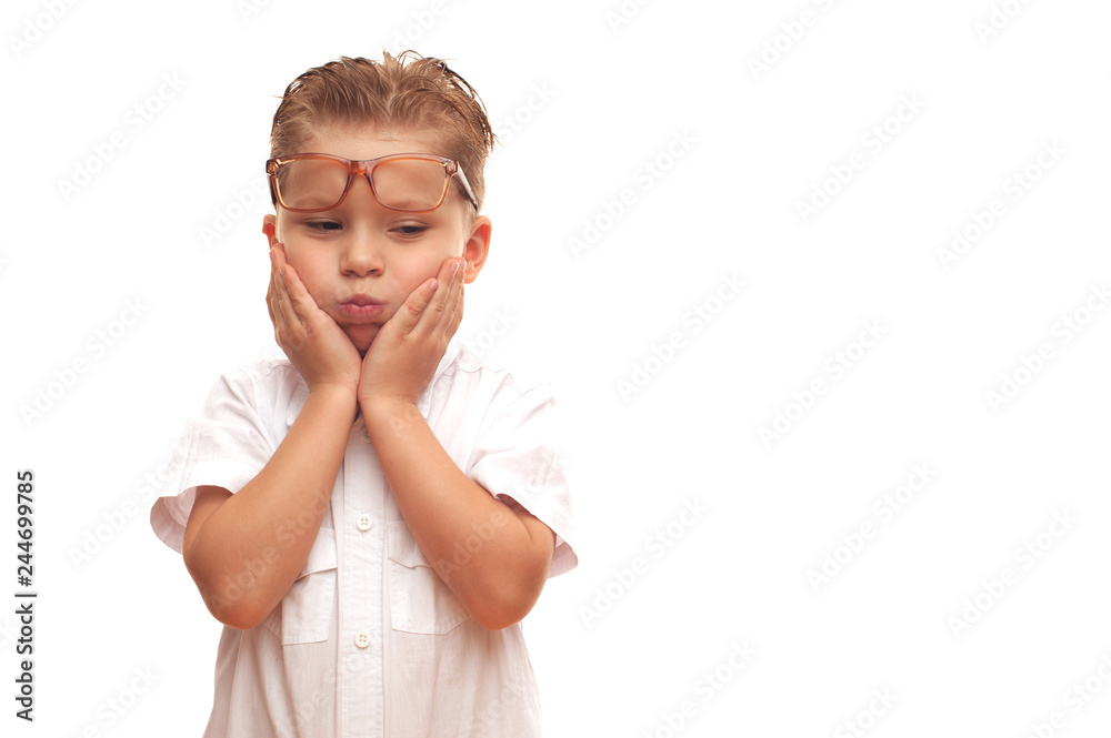 Little handsome pensive child in a shirt and glasses Little handsome pensive child in a shirt and glasses