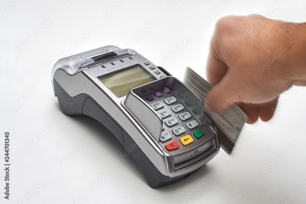 Businessman using payment terminal to pay with credit card. Businessman using payment terminal to pay with credit card.