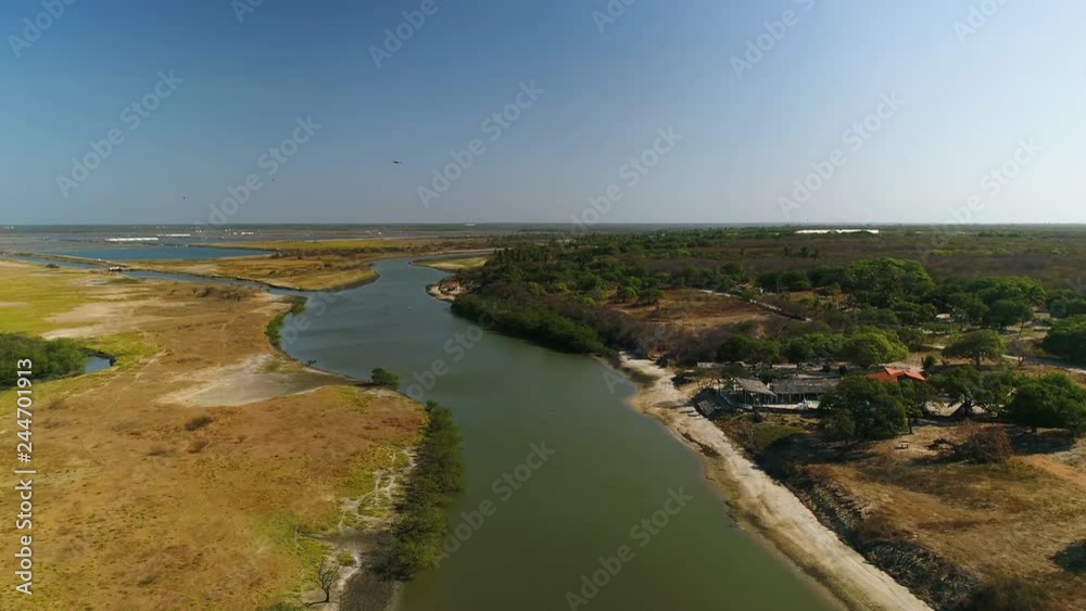 Aerial view of private residence near turbid river water, Brazil. Aerial view of private residence near turbid river water, Brazil.