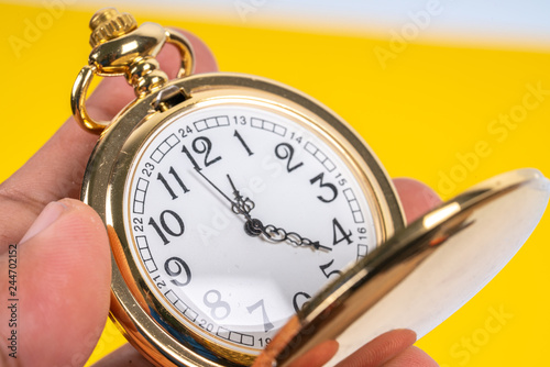 Pocket watch with close up view.