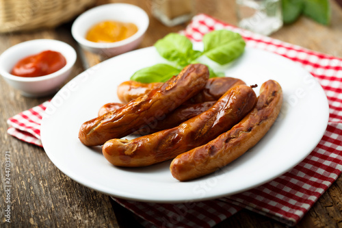 Grilled sausages with tomato sauce