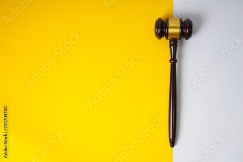 Gavel hammer with yellow background