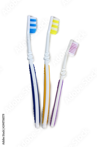 Toothbrushes and tube on white background