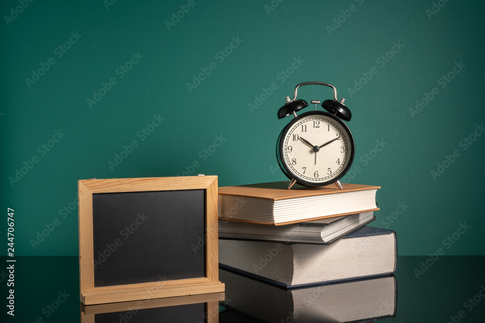 Clock and stalking books with low light Clock and stalking books with low light