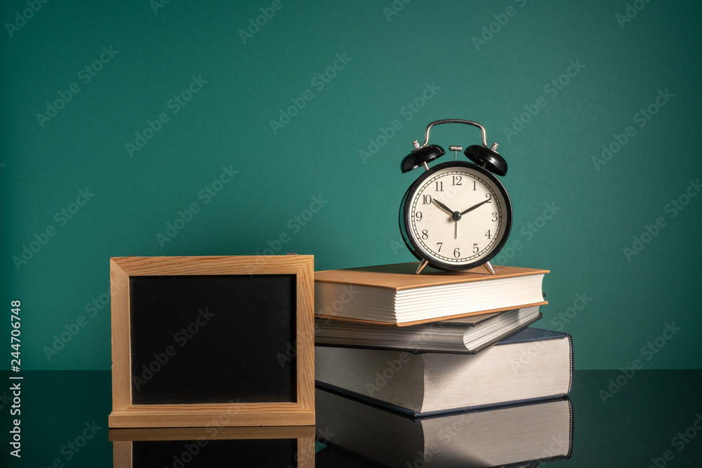 Clock and stalking books with low light Clock and stalking books with low light