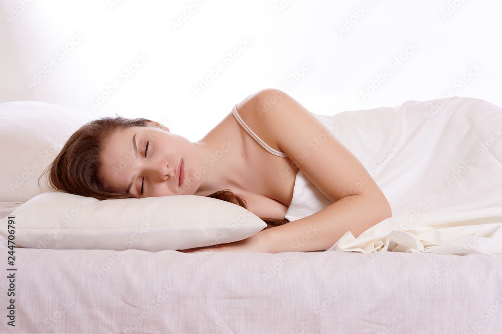 Young beautiful woman sleeping in her bed and relaxing in the morning Young beautiful woman sleeping in her bed and relaxing in the morning